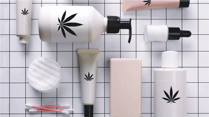 bottles of lotions with cannabis leaves on the labels